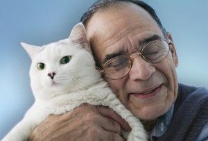 older man with cat